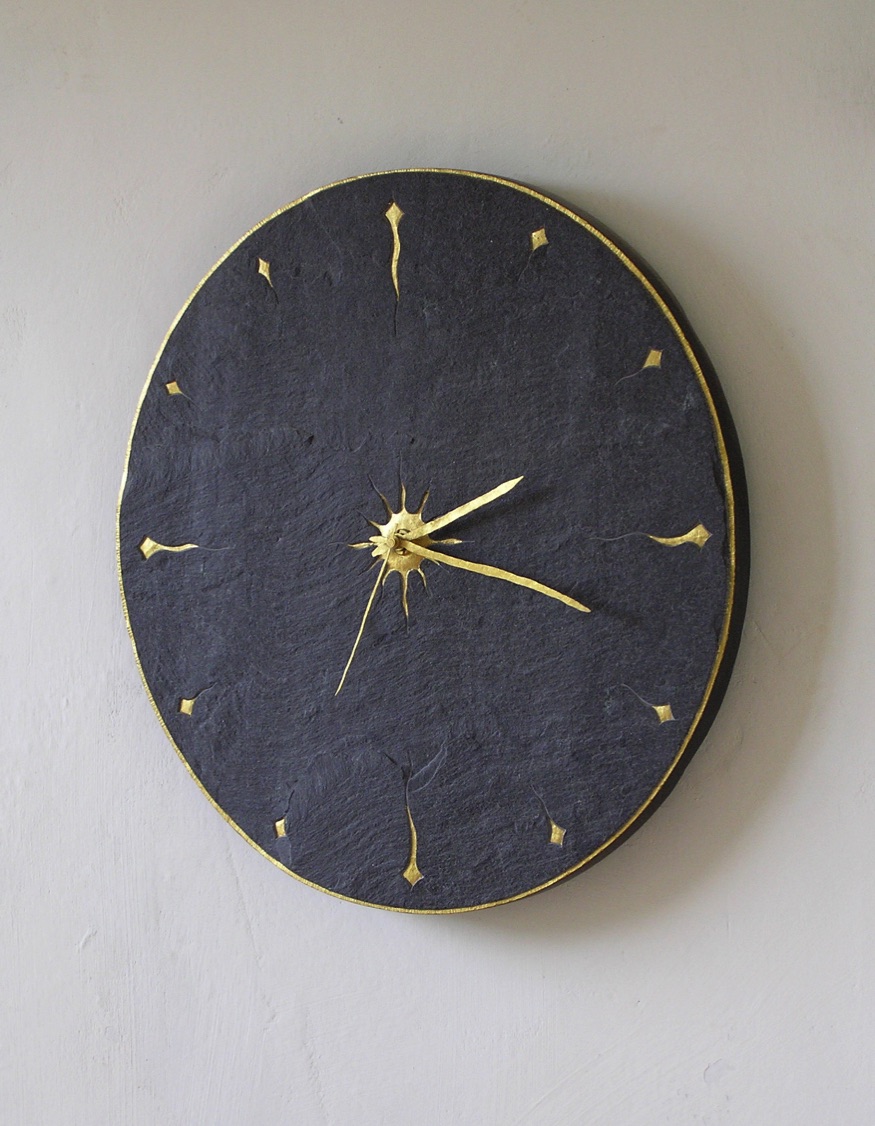 riven welsh slate clock with gilded details